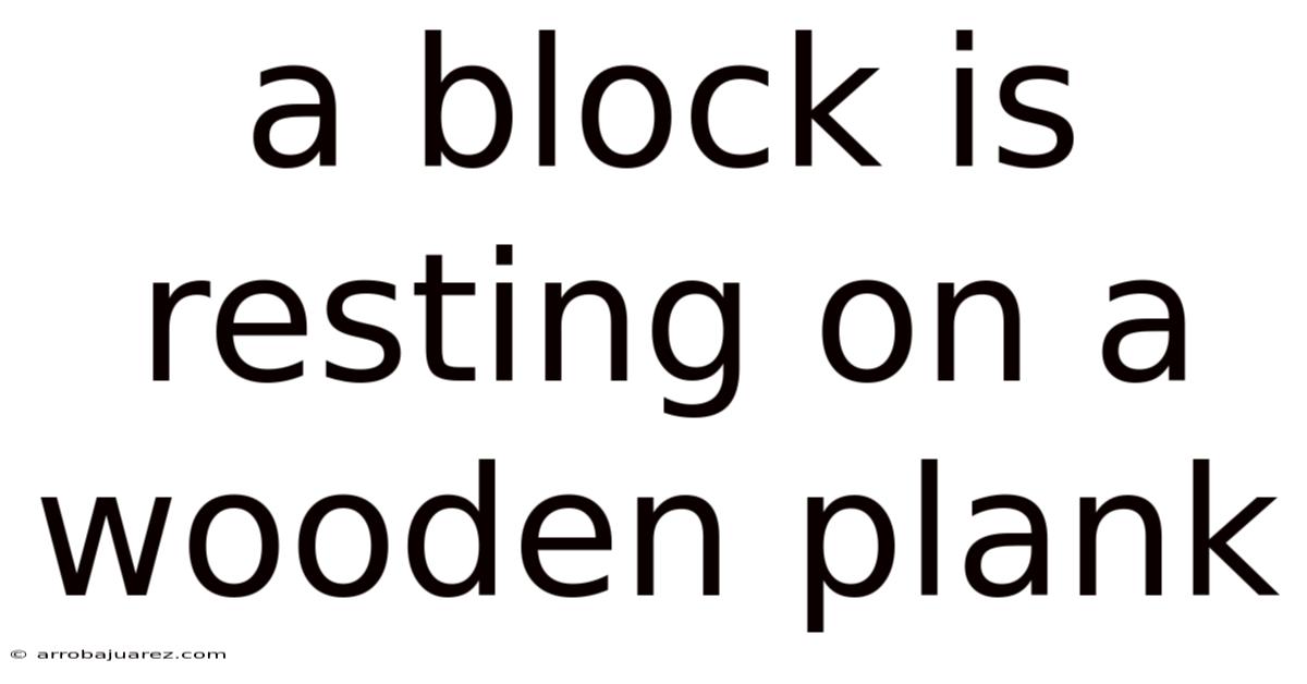 A Block Is Resting On A Wooden Plank