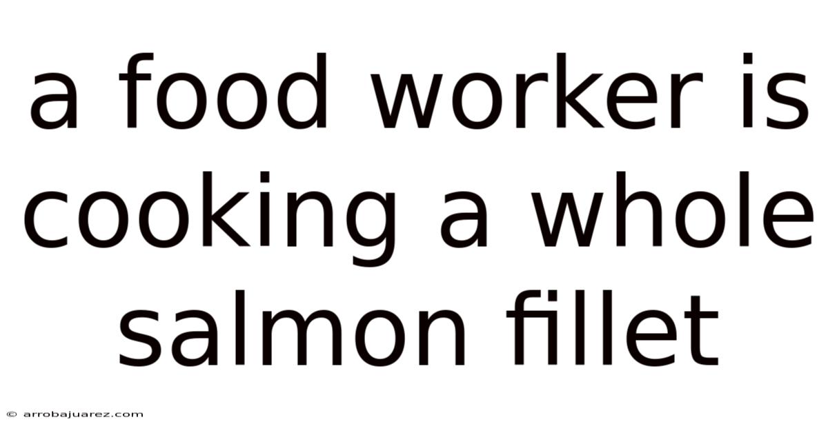 A Food Worker Is Cooking A Whole Salmon Fillet