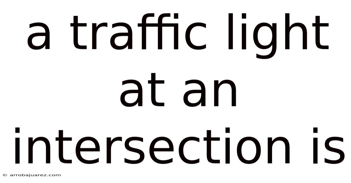 A Traffic Light At An Intersection Is